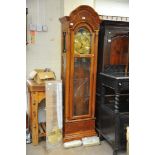 A Howard Miller light oak longcase clock with br