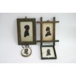 Four small framed silhouettes