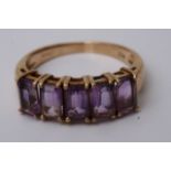 A 9ct gold ring inste with five amethysts (size O)