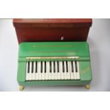 A boxed Hohner Organetta toy piano/organ.