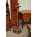 An antique revolving snooker cue stand, approx hei
