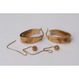 Two pairs of 9ct gold earrings comprising a large