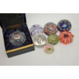 A collection of eight assorted paperweights includ