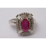 A 14ct white gold, ruby and diamond ring, ruby app