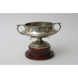 An Elkington silver trophy cup on wooden stand, ap
