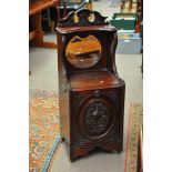 A mahogany coal scuttle with mirror back.