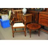 A mahogany occasional table with a pie crust top a