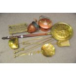 A collection of copper and brassware including a w