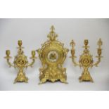 A Japy Freres gilt metal clock garniture with orna