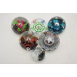 Six unboxed Caithness paperweights comprising a l