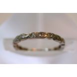 A gold and diamond eternity ring. Size between N a