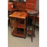 A reproduction inlaid mahogany revolving bookcase