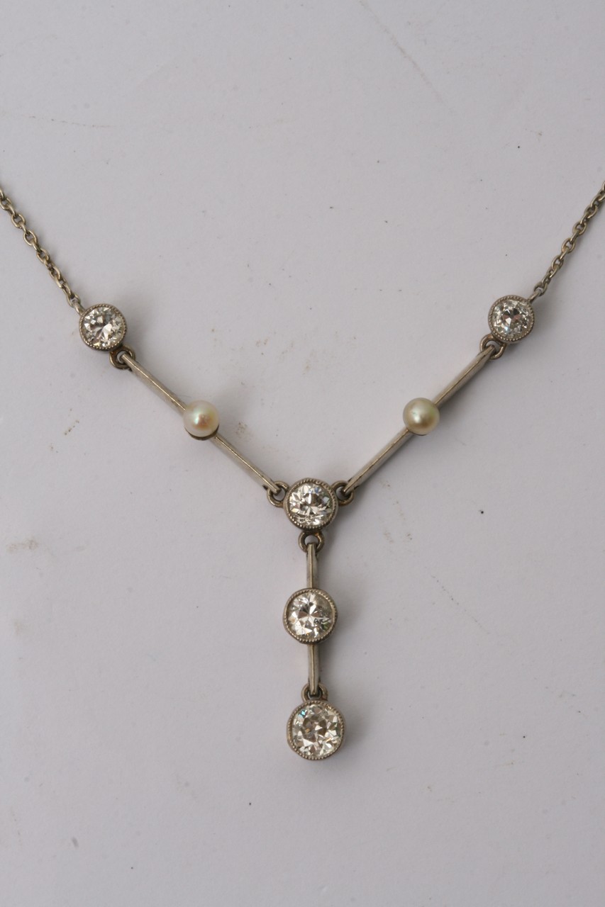An Art Deco style necklace with drop diamond and p