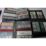 Three albums of Great Britain presentation packs