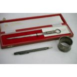 A cased silver meat skewer or letter opener, napki