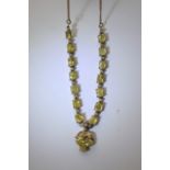 A vintage diamond and yellow sapphire necklet.