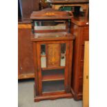 An Edwardian mahogany inlaid music cabinet