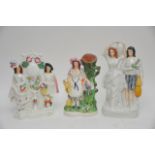 Three Staffordshire figures including Spill Vase 2