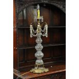A large glass lamp with drop fittings on gilt meta