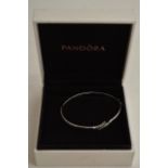 A 9ct white gold bracelet and a pendant set with Z