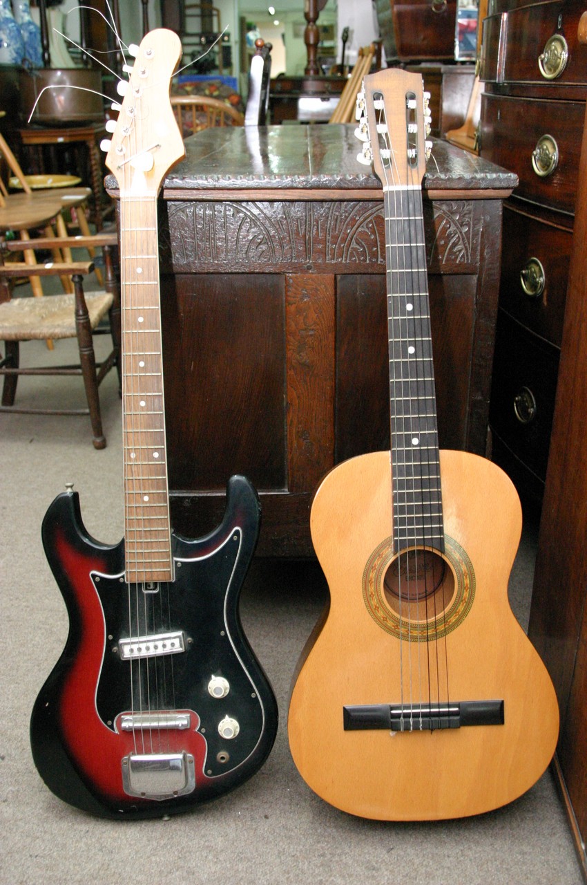 A Japanese electric guitar and a child's acoustic