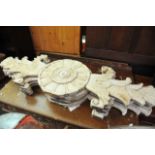 Four large carved and painted wood Tudor Rose desi