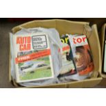 A box containing vintage motor magazines, from the