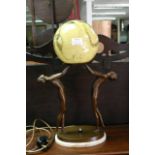 An Art Deco style bronze figural lamp depicting tw