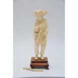 A Carved Ivory 19th century of an elder holding a