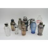 A collection of ten cocktail shakers including chr