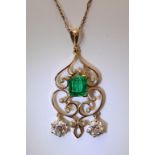 A quality gold pendent, of open design set with a
