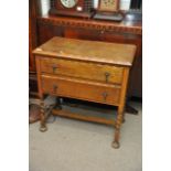 An oak two drawer cabinet with barley twist suppor