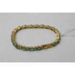 A quality 18ct gold emerald and diamond bracelet e
