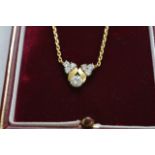 A quality 18ct yellow gold diamond pendent and nec