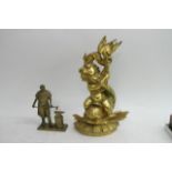 A large gilt metal cherub doorstop and a brass model of a blacksmith. Approximately 40 and 20cm