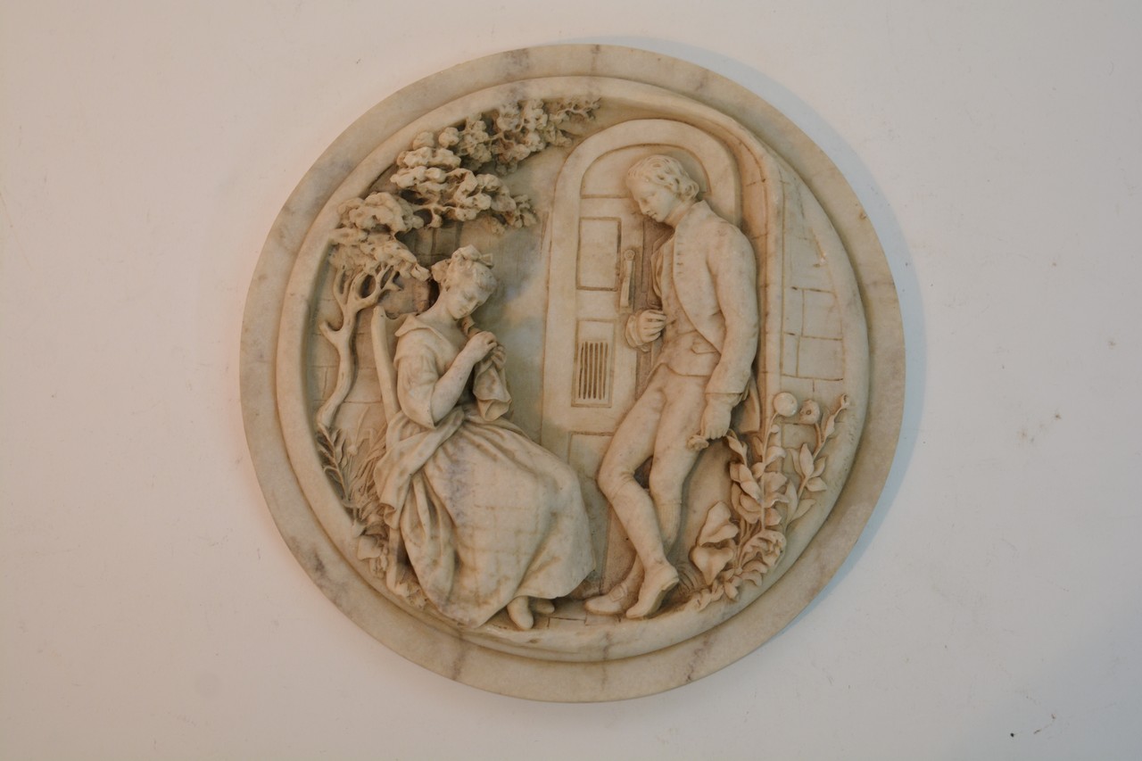 A Victorian alabaster type plaque, well carved wit