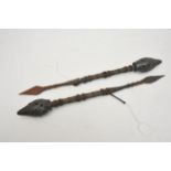 A pair of African tribal daggers with decorative w