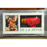 A framed boxing montage containing a signed Oscar