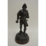 A Spelter figure in the form of a Knight on s circ