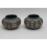 A matched pair of Doulton Lambeth squat shape vase