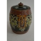 A small Royal Doulton tobacco jar with applied scr