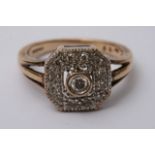 An Art Deco style ring inset with a entral diamond