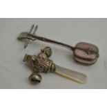 A Silver child's rattle and a silver miniature mus
