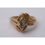 A 14ct gold ring set with a pear shaped diamond fl
