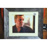 A mounted and framed signed Ray Winstone
