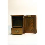 An arts & crafts style smokers cabinet