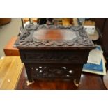 A small Oriental carved folding Scholars desk the