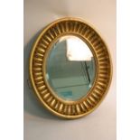 A Regency style gilt oval wall mirror