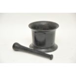 An old cast iron pestle and mortar