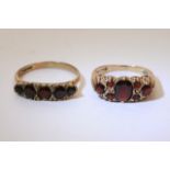 Two 9ct gold rings set with garnets.